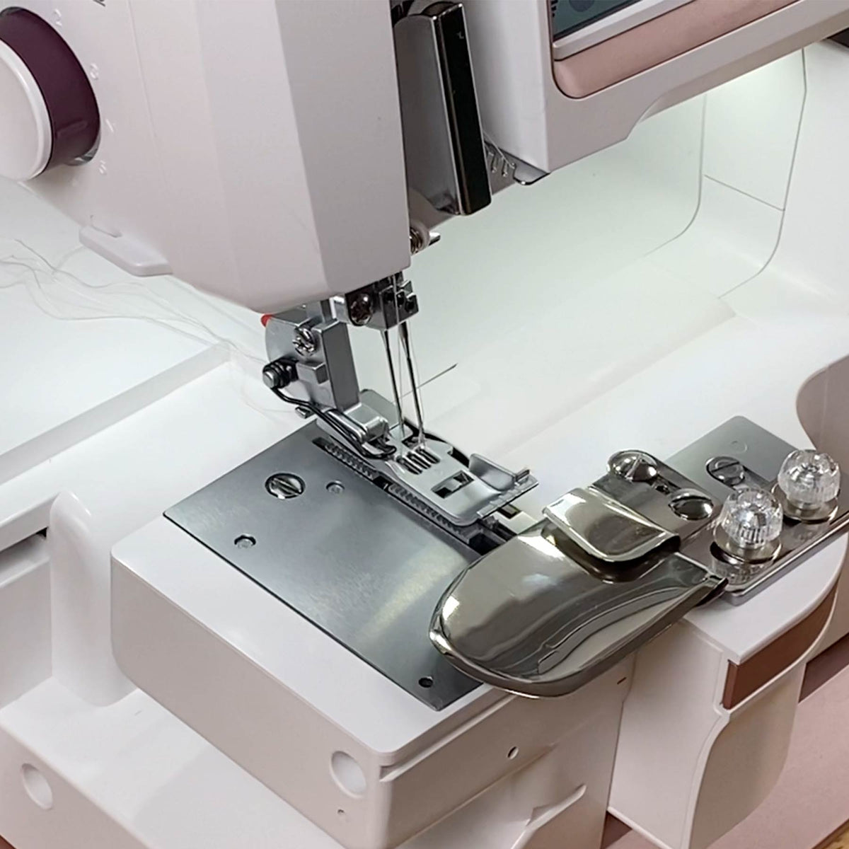 Husqvarna Viking Coverstitch Hemmer 920634096 fitted to a coverlock machine